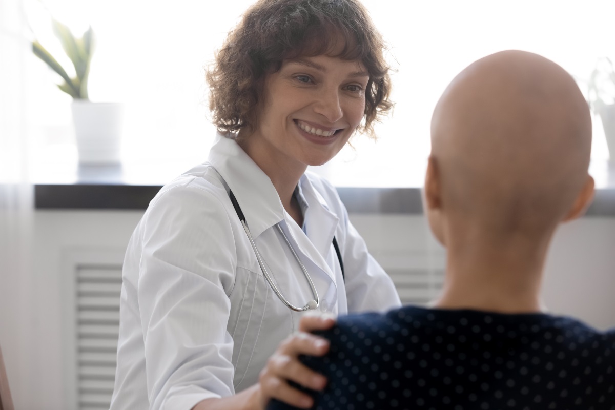 Medical professional with chemotherapy patient