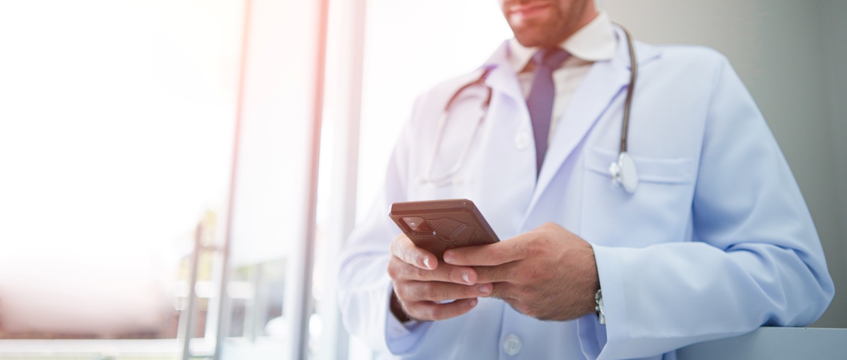 Healthcare professional holding cellphone